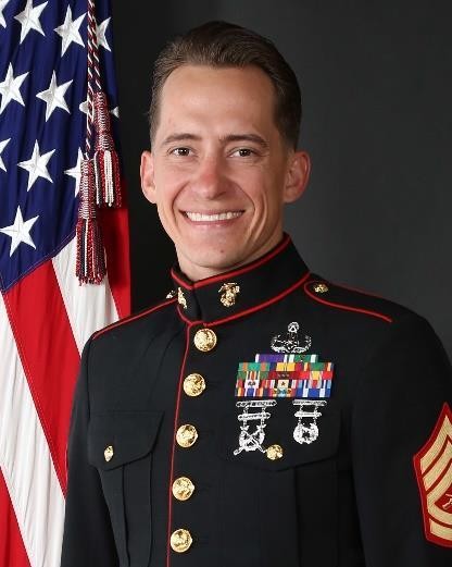 Mike Kinsel in Marine Corps dress blues beside the United States flag