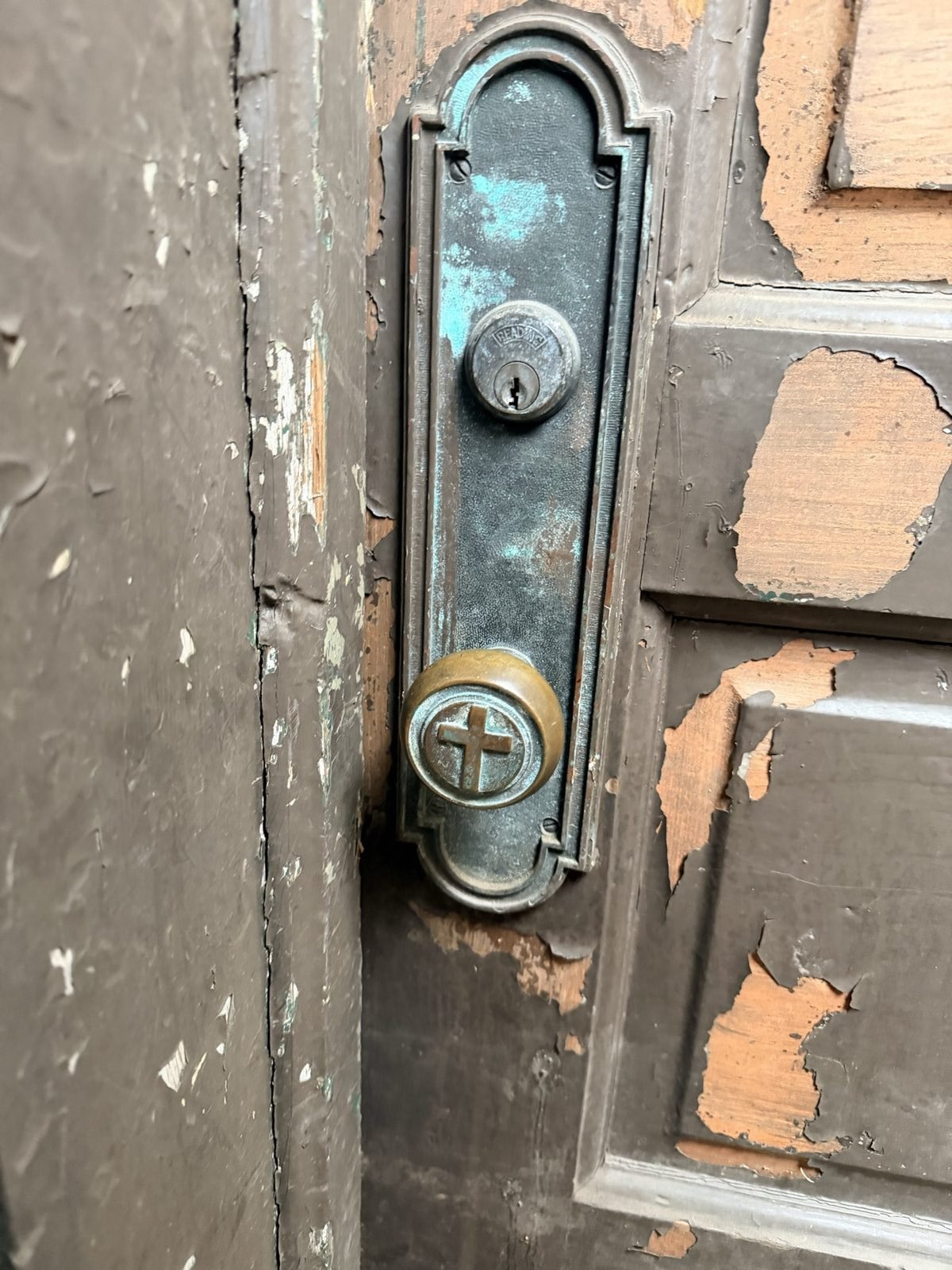 The original cross-shaped door hardware, up close